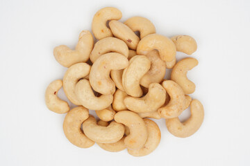 Heap of delicious cashew nuts isolated background