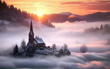 Fotobehang Catholic Church against the backdrop of sunrise and morning fog in the mountains. religion and christianity © photosaint
