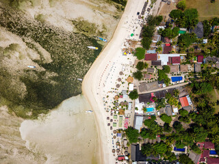 Aerial view of colorful sunshades on a tropical beach (Gili Air, Indonesia)