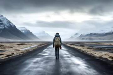 Küchenrückwand glas motiv traveler walks along the road against the backdrop of a beautiful mountain natural landscape © photosaint