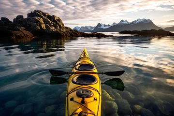 Foto op Canvas yellow kayak boat floats down the river in the fjords of Norway © photosaint