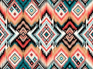 Seamless ethnic ikat pattern, ideal for backgrounds, wallpapers, and textiles. Embodies traditional embroidery in a vector illustration for versatile design uses.