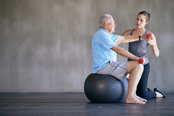 Physical therapy, dumbbells and senior man on ball for fitness, rehabilitation or exercise at gym on mockup. Elderly person, weightlifting and training with physiotherapist for help or body health - obrazy, fototapety, plakaty