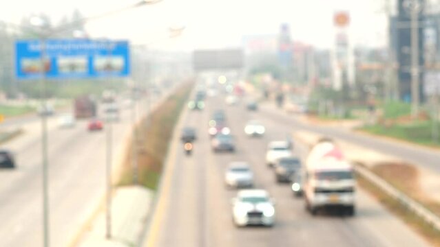 Blurred Traffic on highway with dust background , Chiangmai Thailand.