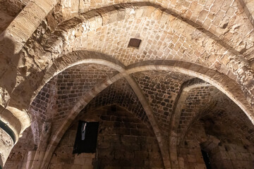 Stone arched vault in the dining room at the Templar fortress in the Acre old city in northern...