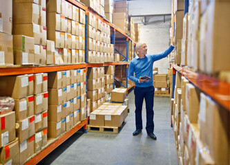 Boxes, shelf or man in factory for stock or logistics info for a delivery order on tablet in...