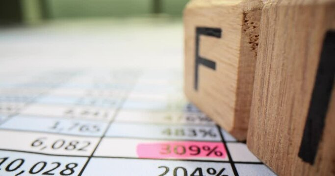 Cubes form the inscription finance standing on documents