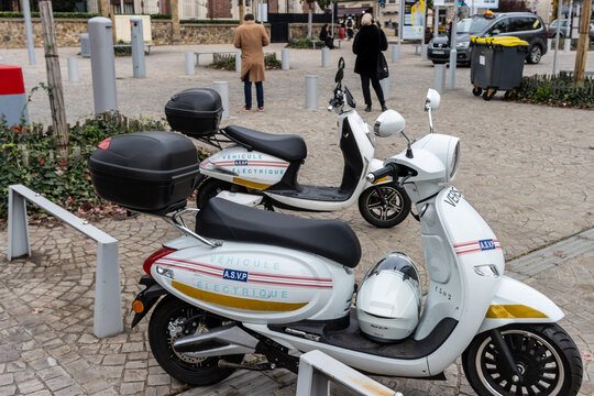 Paris, France, 8 November 2024 : Electric Scooters for Security Patrol Lined Up on Sidewalk.