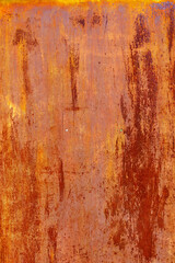 rusty red painted flat sheet metal surface with leftovers of white paint full-frame background and texture.