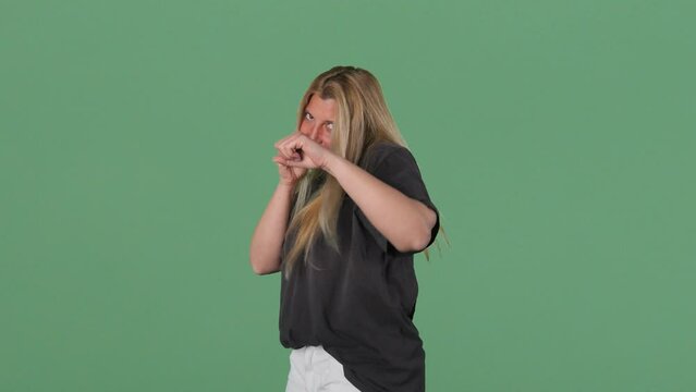 Blonde Woman Shadow Boxing Towards Camera Green Screen Background Fighter Intro