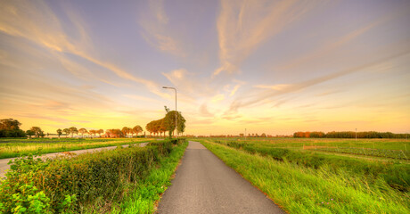 Sunset over a pastoral landscape in Holland.
