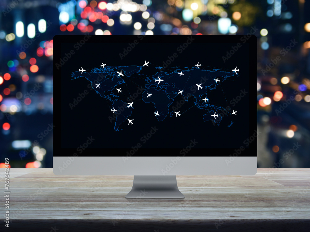 Poster flight routes airplanes connection and world map on computer screen on table over night light traffi