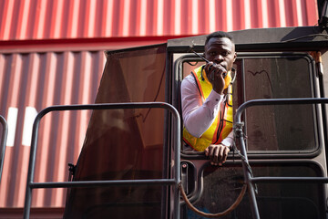 African logistic engineer man worker or foreman working and driving forklift container at container site	 - 767647202