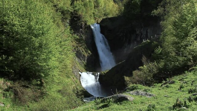 General view of the double waterfall and the green surroundings. Saut deth Pish in the Aran Valley (Catalan Pyrenees)