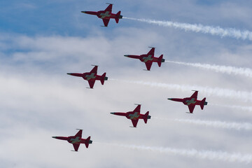 Patrouille Suisse doing aerobatics at Swiss Army exhibition at shooting range of Swiss City of Bülach on a sunny summer day. Photo taken August 18th, 2023, Bülach, Canton Zürich, Switzerland. - obrazy, fototapety, plakaty