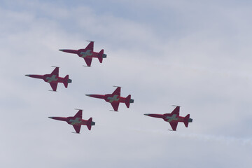 Patrouille Suisse doing aerobatics at Swiss Army exhibition at shooting range of Swiss City of Bülach on a sunny summer day. Photo taken August 18th, 2023, Bülach, Canton Zürich, Switzerland.