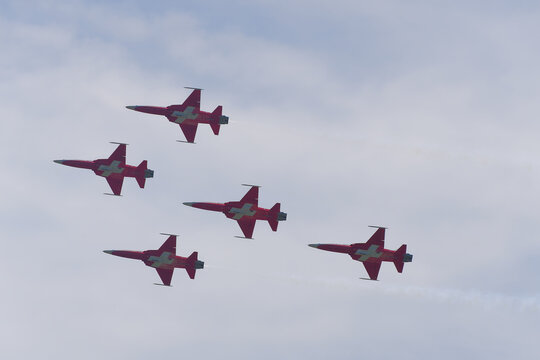 Patrouille Suisse doing aerobatics at Swiss Army exhibition at training ground of Swiss City of Kloten on a sunny summer day. Photo taken August 18th, 2023, Zurich Kloten, Switzerland.
