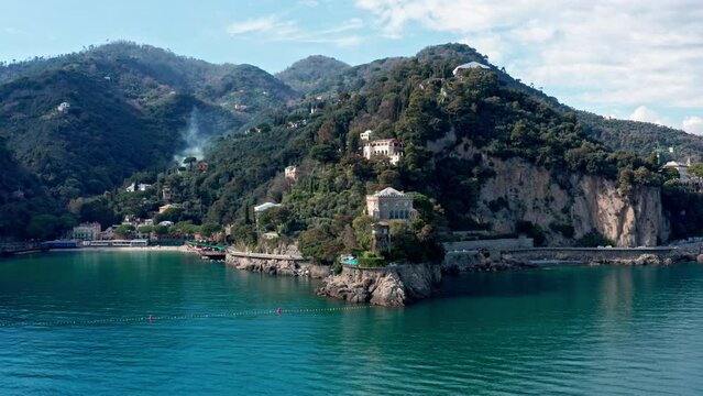 Aerial shot along Ligurian coast with view of Paraggi Bay near Portofino, Italy