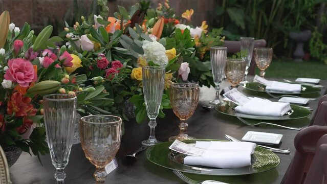 Crystal glasses placed on the wedding banquet table along with elegant tableware