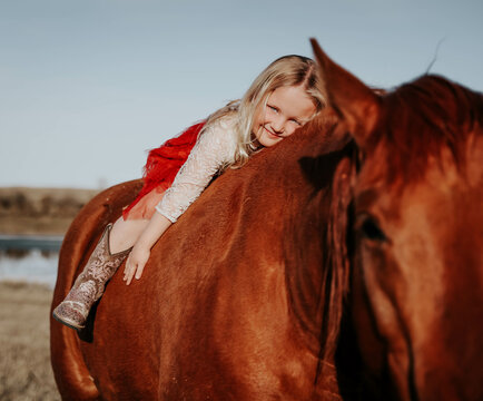 Blonde Charm: 4-Year-Old Girl and Her Horse Forge Unbreakable Bond!