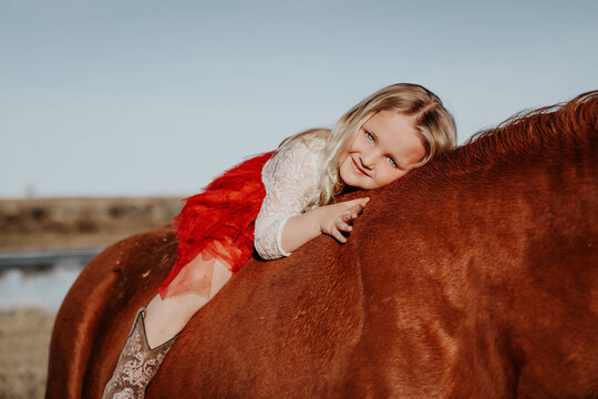 Blonde Charm: 4-Year-Old Girl and Her Horse Forge Unbreakable Bond!
