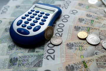 Pln polish money zloty with coin grosz and calculator - obrazy, fototapety, plakaty