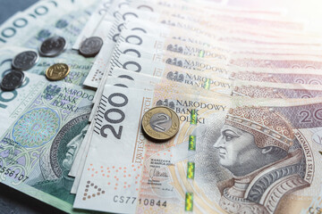 Polish 100 200 zloty banknote and coins grosz as background - obrazy, fototapety, plakaty