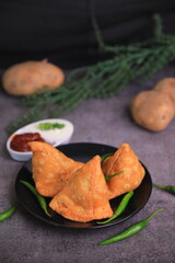 Samosa Indian famous street food snack closeup with selective focus and blur