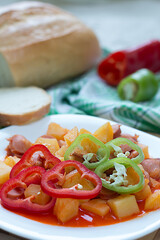 Hungarian paprika potatoes with bread.