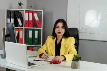Female agent salesman prepare documents for buy insurance or lease car at office