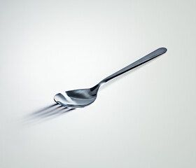 Spoon, shadow and fork with mockup space, utensils and kitchen tool on a white studio background....