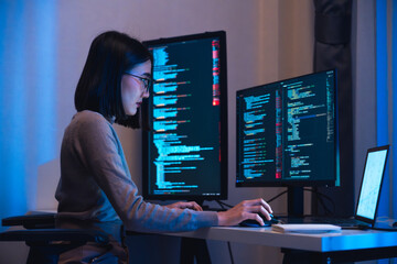 asian woman  developer devops  coding software data working  at night in office - 767692265