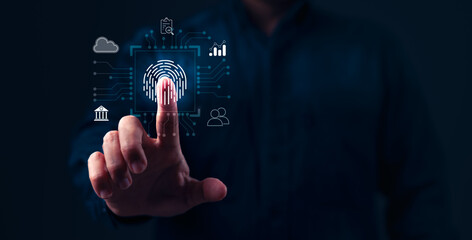 A man is pressing a button on a screen that has a fingerprint on it