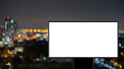 mock up billboard with frame on blur background of modern night city with commercial and office buildings for announcements and advertisement marketing concept