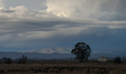clouds over the mountains in the delta del Ebro