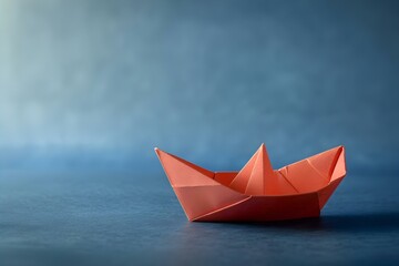 Obraz premium A paper boat sailing on a blue surface symbolizing leadership and innovation in business and social media. Concept Leadership, Innovation, Business, Social Media, Symbolism