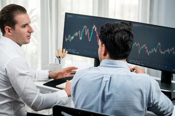 Investor stock office worker analyzing investment business trend on dynamic exchange rate database...