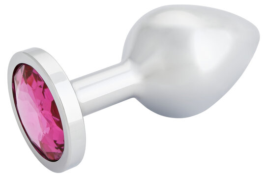 Stainless steel anal butt plug with a pink crystal isolated on a transparent background. Completely in focus.
