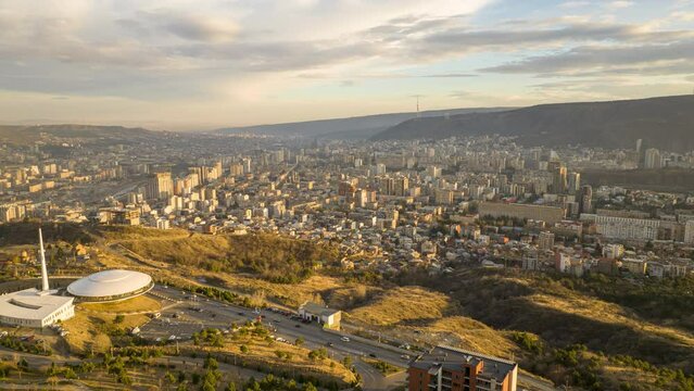 Sunset cityscape of Tbilisi city. Aerial hyperlapse