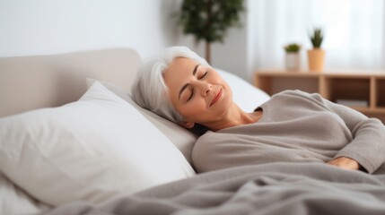 Obraz na płótnie Canvas Peaceful Senior Woman Sleeping Comfortably in Bed