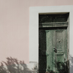Italy. An old vintage wooden door. Traditional European architecture. Minimal travel concept