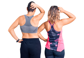 Couple of women wearing sportswear backwards thinking about doubt with hand on head