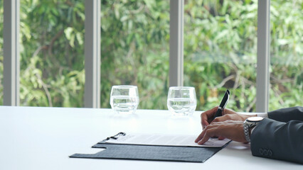 Businessman hands note meeting document in conference room. man Hands writing planning notebook....