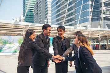 Diversity Business people partner handshake together in modern city. Teams meeting trust in teamwork partnership with businessman and businesswoman. Group of people shaking hands together teamwork