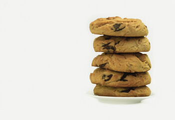 Homemade chocolate cookies. A stack of delicious chocolate chip cookies on a gray table
