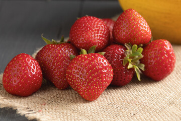 Berries of ripe, juicy strawberries. Fresh strawberries. Close-up. Wooden, rustic background. Copy space