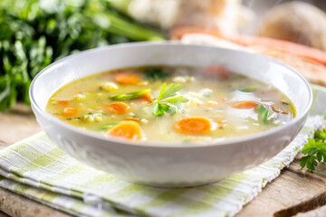 Spring vegetable soup with chopped and grated root vegetables, seasoned with yeast. Healthy vegetable vegetarian food - 767745858
