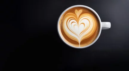 Foto auf Acrylglas The cup of latte coffee with heart shaped latte art on dark background © Viktorija