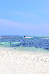 Fototapeta na wymiar Maafushi Maldives - February 2022 : Beautiful turquoise waters on a hot sunny relaxing day. 