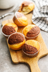 Close Up of a Muffins on cutting board on kitchen table